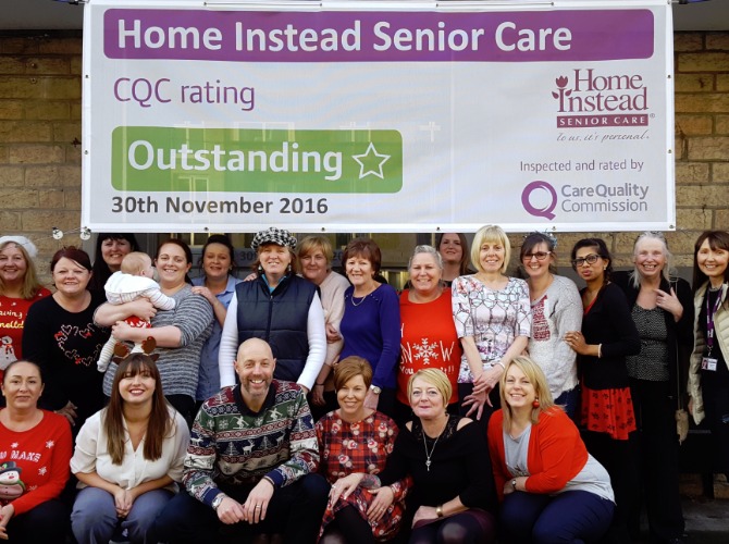 photo of Caregiver team with outstanding banner
