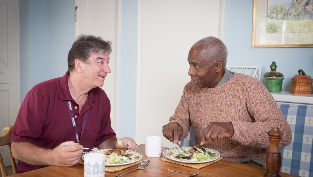 Rotherham CAREGiver dines with elderly person