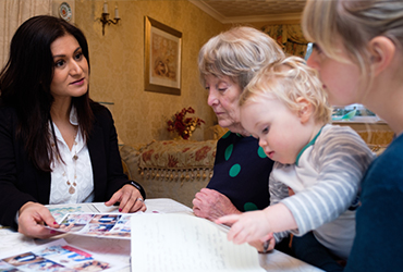 Family talking to a Home Instead care manager about their options
