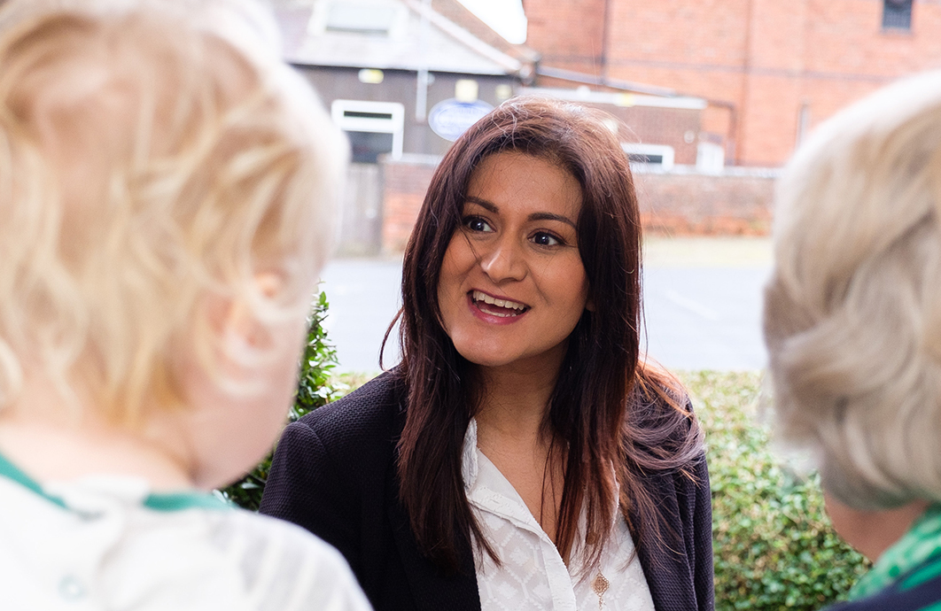 Family welcoming a Home Instead care manager into their home