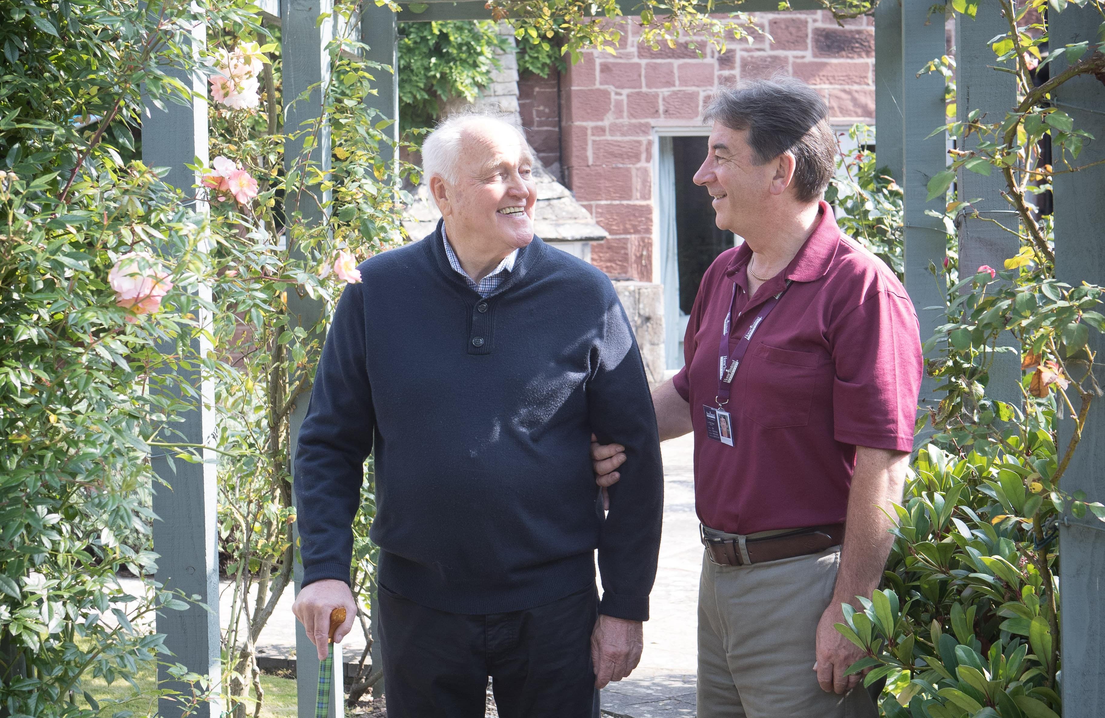 Client with CAREGiver in garden