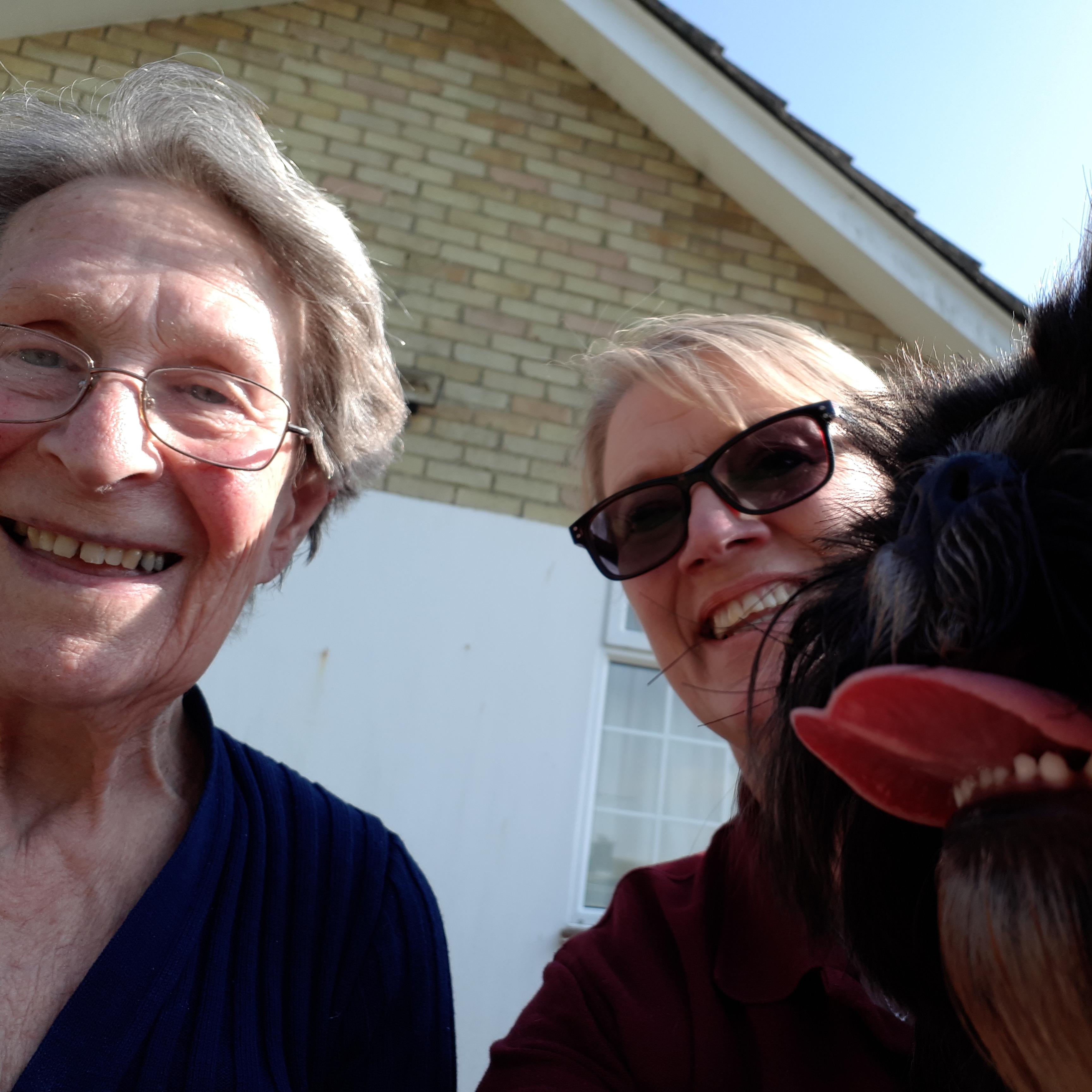 Tina bringing her puppy, Prince, for a walk, bringing a big smile to her Client
