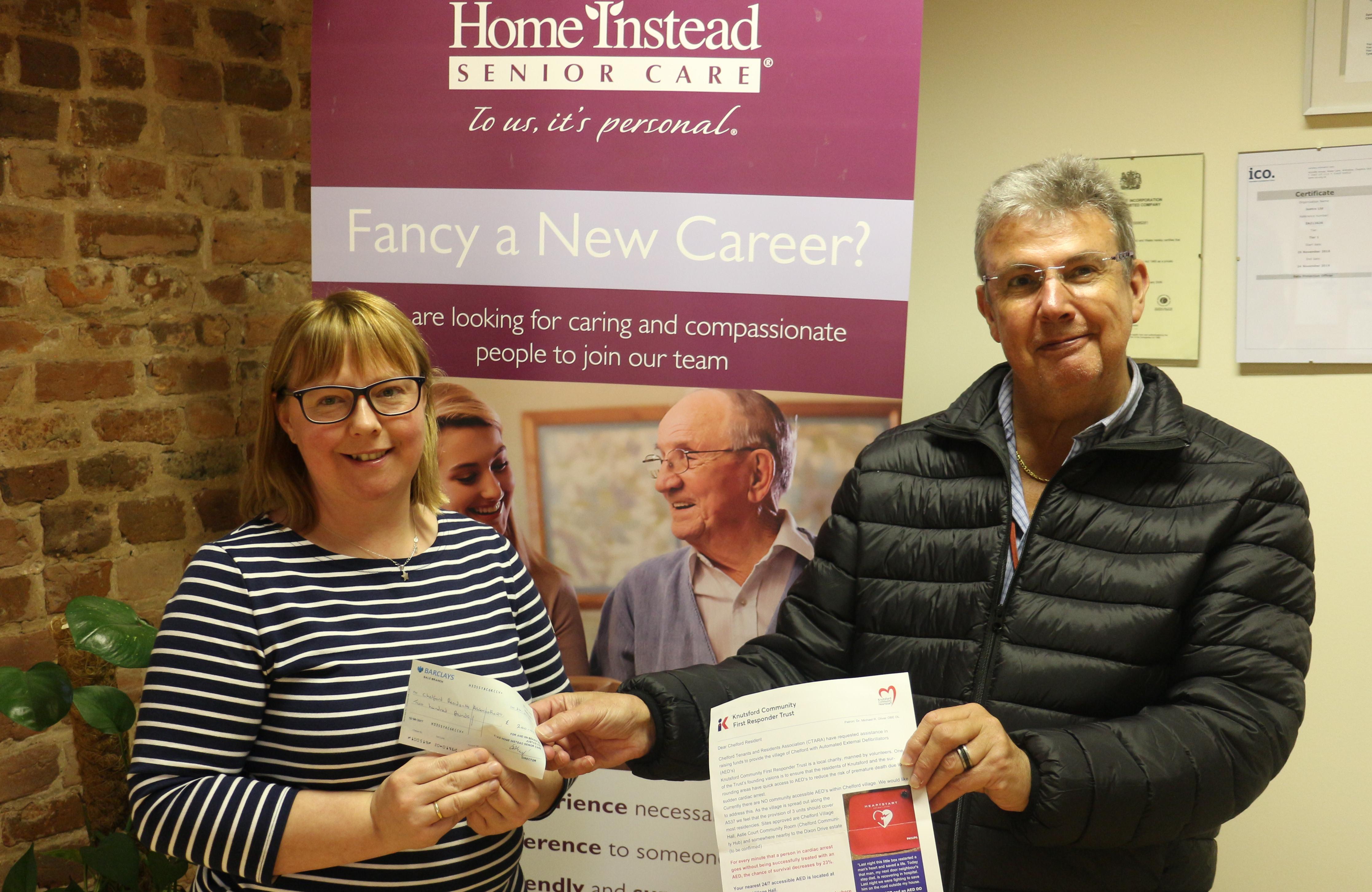 David Kent receives a cheque from Kinga