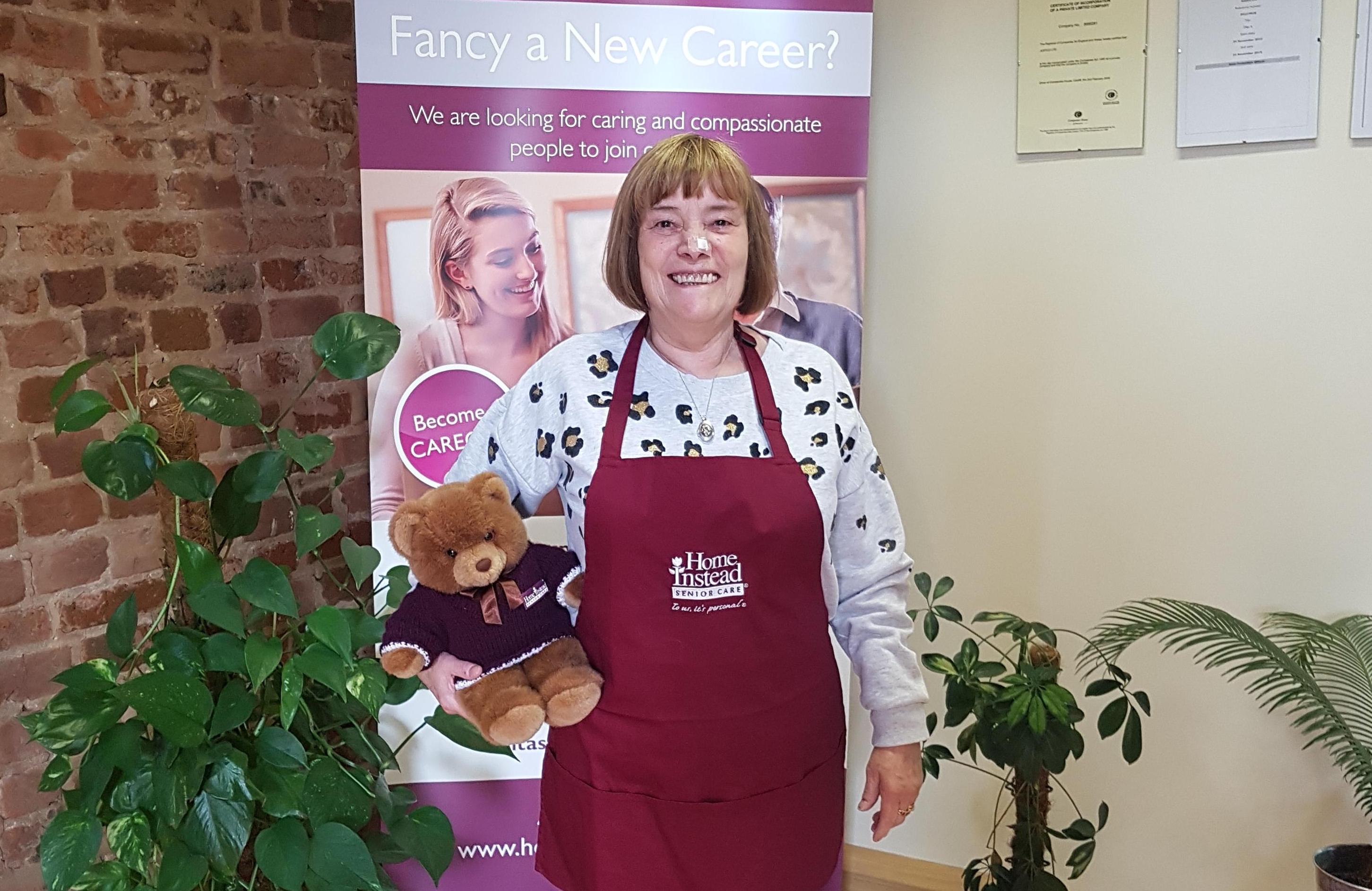 CAREGiver Linda sports her pancake day pinny along with Home Instead Ted