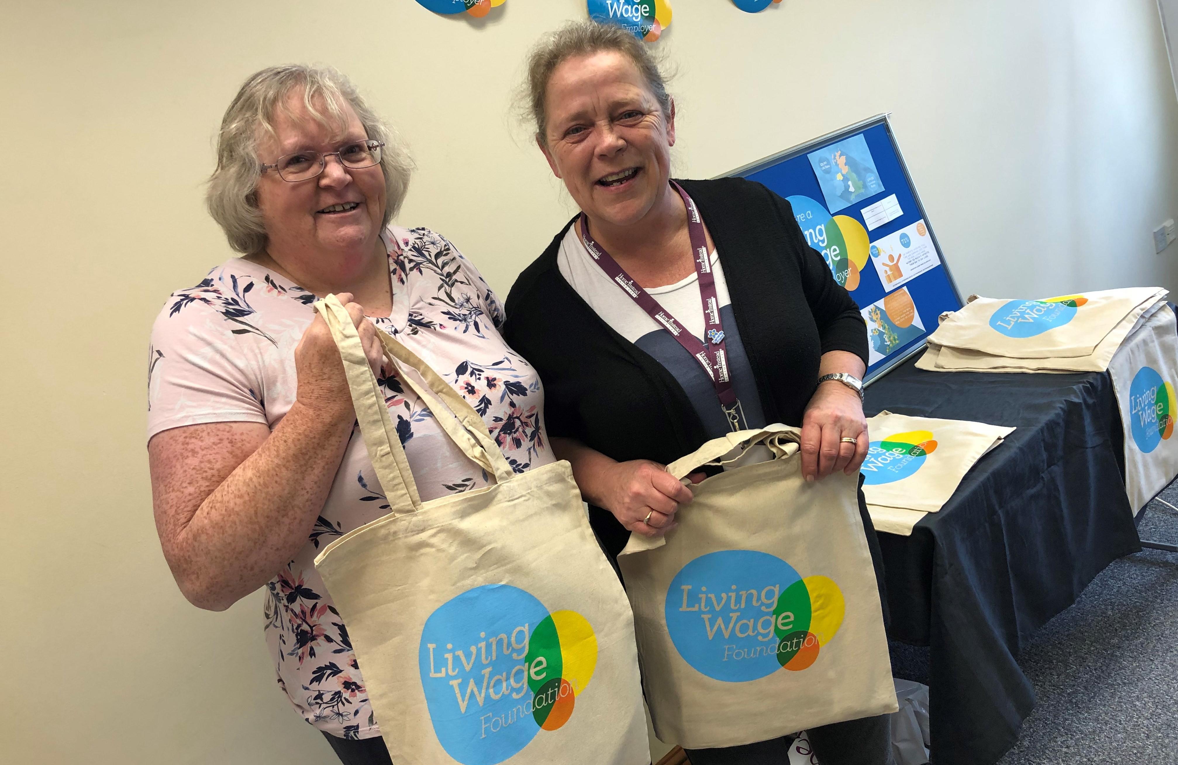 CAREGivers with their Living Wage Employer Goodie Bags