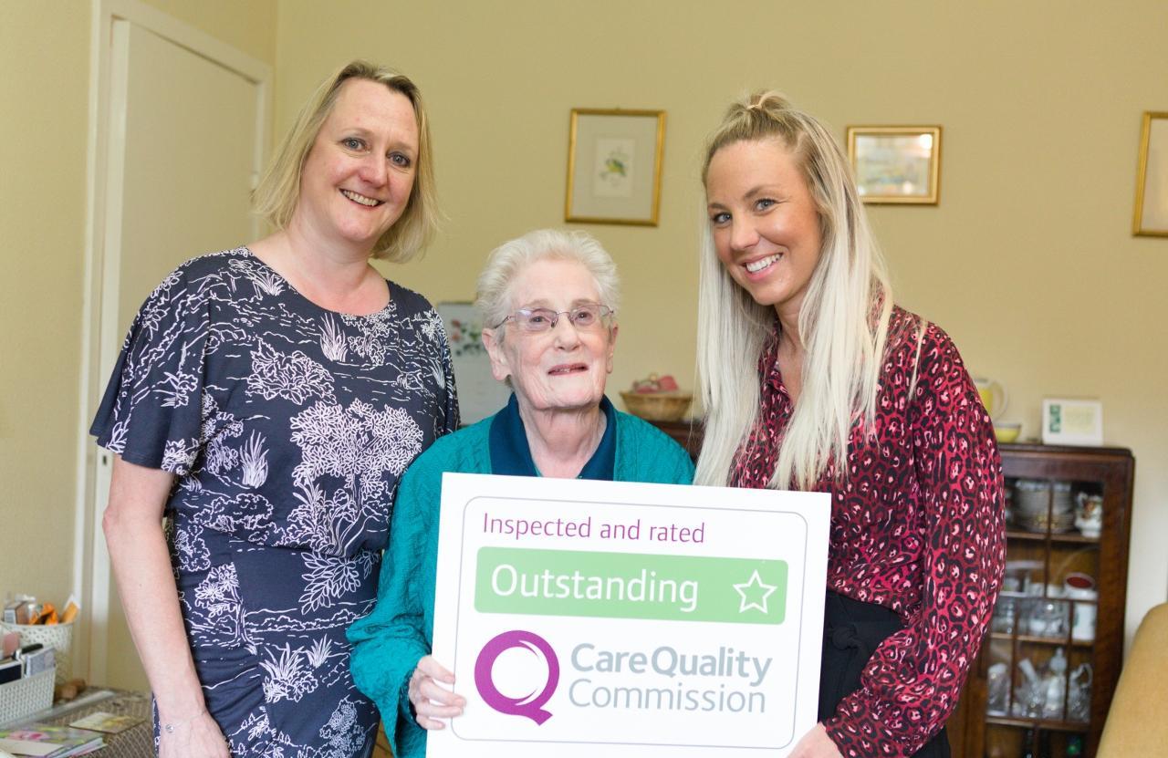 Photo of Lorna Bath with client and team