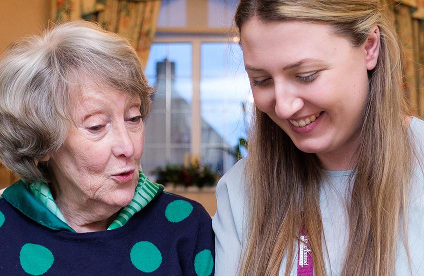 lady singing with caregiver